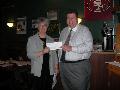Cupertino/Sunnyvale District Chair and SILVAR President-elect Mark Burns hands Nancy Tivol, executive director of the Sunnyvale Community Services, a check for $500 for the agency