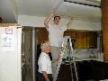 Jeff Beltramo and Connie Goddard cleaned a kitchen light fixture for a senior homeowner in Saratoga.