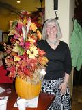 Sharon Butler is pleased with the beautiful pumpkin arrangement she won.