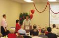 Mark Burns serves as auctioneer and opens the bidding.