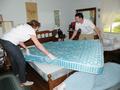 Dante Drummond and Jeff Beltramo are pictured here turning a mattress.