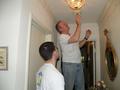 Michael Hall and Dennis Deslauriers check the smoke detector of another Palo Alto senior homeowner.