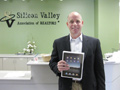 A happy Don Knight is pictured here. He won the other big raffle item: a 16-GB Apple iPad and case, donated by the Los Altos/Mountain View Broker/Manager Committee.