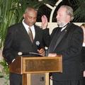 C.A.R. President-elect LeFrancis Arnold administers the oath of office to Gene Lentz.