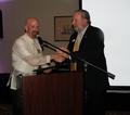 2011 SILVAR President Gene Lentz congratulates 2011 FAREPA President Paul Stewart.
