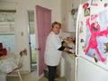 Victoria Curran cleans the sink for a Los Gatos senior who is homebound.