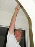Dan Retter gets ready to replace a smoke detector battery.