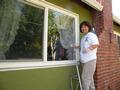 Christine VanAken washed windows at a Saratoga home.