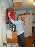 Mary Callaghan is pictured here dusting the home of a Saratoga elderly couple.