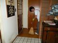 Here is Nancy Carlson sweeping the hallway for a senior.