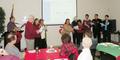 SILVAR Customer Service Representative Jake Terry dances the hula, Tony Lacy-Thompson plays the guitar while Richard Miller, Niki Maroko, Janet Witkin, Bill Orrock, Diane Renna, Kyle Chuang and Eric Temple lead members in song.