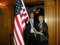 Executive Officer Paul Cardus and SILVAR Treasurer Phyllis Carmichael bring in the flag.