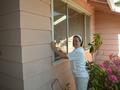 Beth Tompkins washing windows.