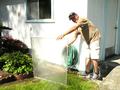 Rick White washes screens for a Los Gatos elderly couple.