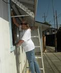 Sherry Hagen washes windows.