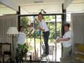 Evelyn Figueroa, Kacy Buchin and Elena Tallis clean windows for a 90-year-old Palo Alto homeowner.