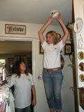 Kathy Hearn Bosse and Mandy Safka (right) replace smoke detector batteries for a Menlo Park senior.