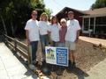 Dave Barca, Mandy Safka, Kathy Hearn Bosse and Jim Taggart pose with a very grateful Menlo Park senior.