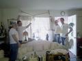 The men try to put on a lace curtain - Bob Conway, Dave Barca, Doss Welsh and Peter Kitch.