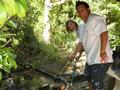 Ryan Iwanaga and Wendy Lannon Potts wash some bricks for a senior homeowner.
