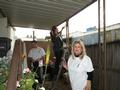 Rob Mibach, Kim Copher and Nancy Domich help a Mountain View senior homeowner.