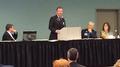 Board Director David Barca speaks at a forum.