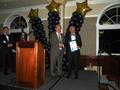 Assemblymember Paul Fong presents David Tonna with a proclamation.
