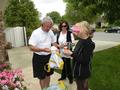 In Saratoga, SILVAR President David Tonna and Diane Chandler hand the senior homeowner an RSVP bag with a vial of life, mask, batteries and other goodies.