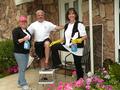 SILVAR Region 9 Chair Suzanne Yost, David Tonna and Diane Chandler get ready to wash the homeowner's windows.
