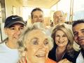 Nancy Domich and her crew do a selfie with a senior homeowner.