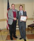 2014 District Chair-elect Robert Reid thanks Jeff Beltramo for serving as this year's district chair. The District recognized Beltramo as this year's District REALTOR&reg; of the Year.
