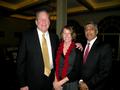 Board Director Robert Reid and daughter with Raj Patel