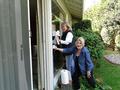 Los Altos/Mountain View District RSVP Chair Dani Fletcher and Nancy Domich wash windows at the home of a Mountain View senior.