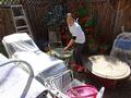 Yang Li cleans the backyard of a Los Altos senior.
