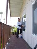 Wayne Haraguchi washes windows.