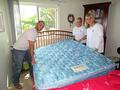 Turning over a mattress for a Palo Alto senior.