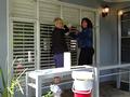 Susan Ward and Wendy Tomaro wash windows.