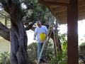 John Van Dyke cleans a senior homeowner's gutters.