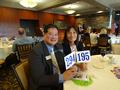 Jimmy Kang and Amy Sung, Palo Alto District Chair-elect, get their paddles ready.