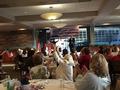 Members cheer as someone agrees to raise his bid.