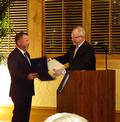 Paul Cardus presents 2015 President Chris Isaacson commendations from the offices of U.S. representatives Mike Honda and Anna Eshoo.