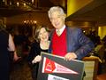 David Zigal congratulates Carolyn Miller.