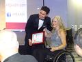 Karen Trolan congratulates Mike Bui on behalf of SILVAR.