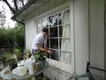 Nick French washes a window for a Los Altos senior homeowner.
