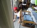 Barbara Miller from the Cupertino/Sunnyvale District cleans a patio door for a Sunnyvale senior.