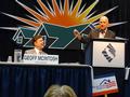 Governor Jerry Brown speaks to California REALTORS&reg; while C.A.R. President Geoff Macintosh looks on.