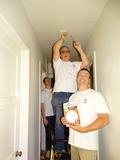 Robert Reid is assisted by Palo Alto District RSVP Chair Jeff Beltramo.