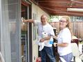 Ryan Nunnally and Lindsay Trolan wash windows for a Los Gatos homeowner.