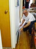 David Tonna is pictured here replacing a furnace filter for the homeowner.