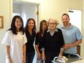 Shown here with the grateful homeowner are Lynne Olenak, Cathy Lynam-Rohrs, Janet Ruiz and Dustin Holdt.